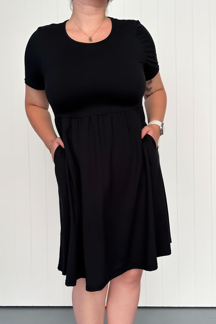 Black - Knee Length Dress - Short Sleeve - Pockets